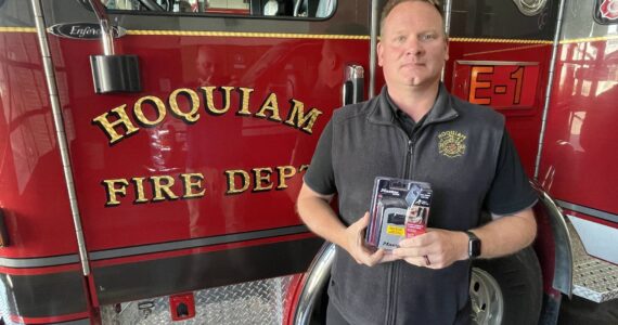Michael S. Lockett / The Daily World
Hoquiam Fire Chief Matt Miller holds a lockbox in the style that will be available for installation free of charge for Hoquiam residents who are concerned about requiring emergency medical care and would prefer their house not be breached by first responders seeking to gain entry.