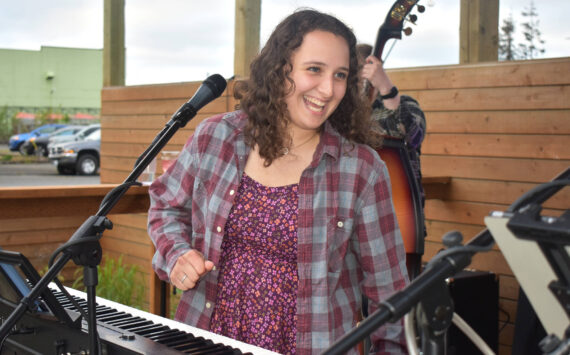 Matthew N. Wells / The Daily World
Amanda Ransom, who sings and plays the keyboard with her Saturday night bandmates on May 20, smiles during a lively and fun performance at Mount Olympus Brewing. Ransom said playing the piano is in her blood.