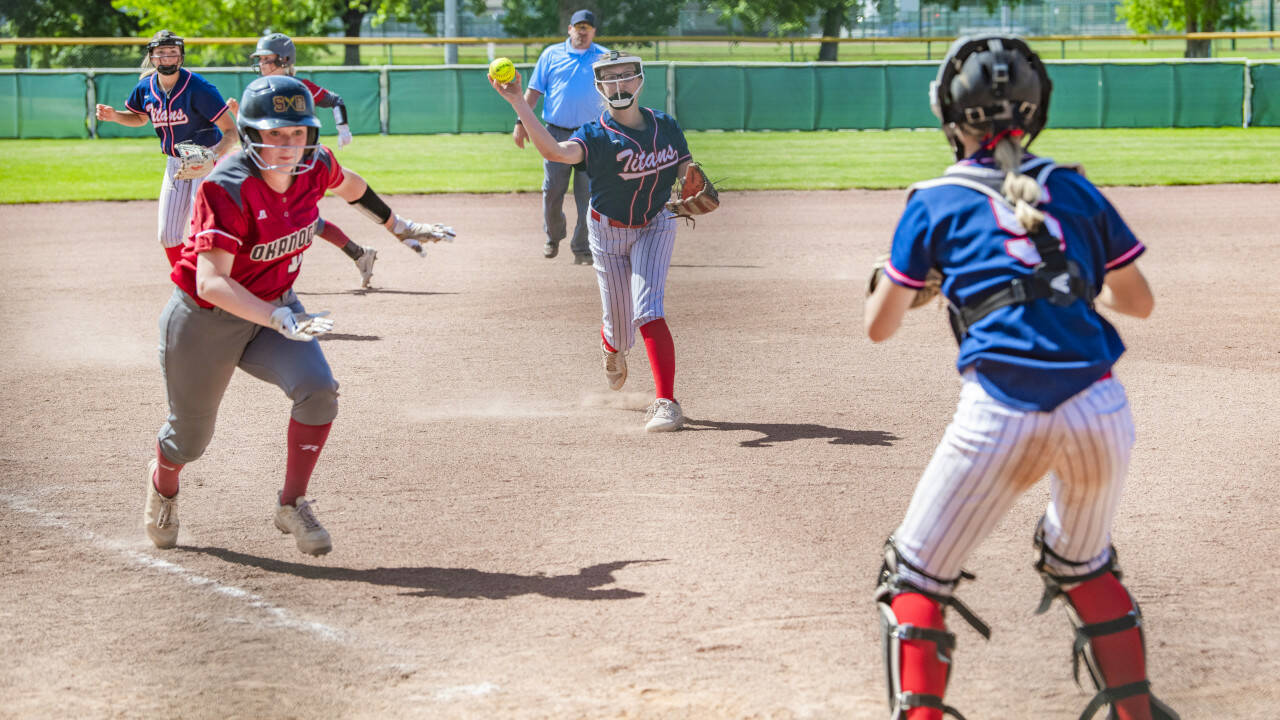 JARED WENZELBURGER | THE CHRONICLE Pe Ell-Willapa Valley pitcher Lauren Emery throws a baserunner out at home plate during a game against Okanogan in a 2B State quarterfinal game on Friday in Yakima.