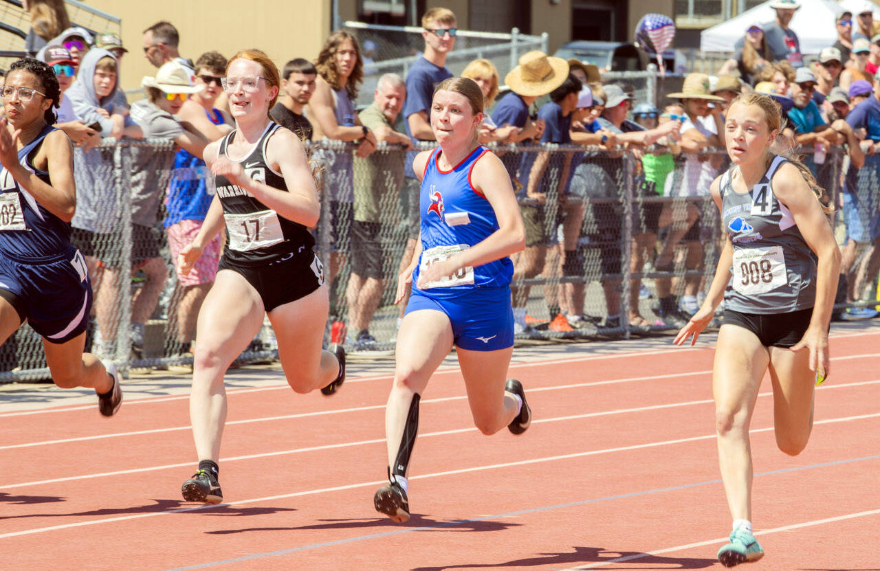 JARED WENZELBURGER | THE CHRONICLE Willapa Valley’s Brooklyn Patrick, second from right, races in the girls 1B 100-meter dash on Saturday in Yakima.