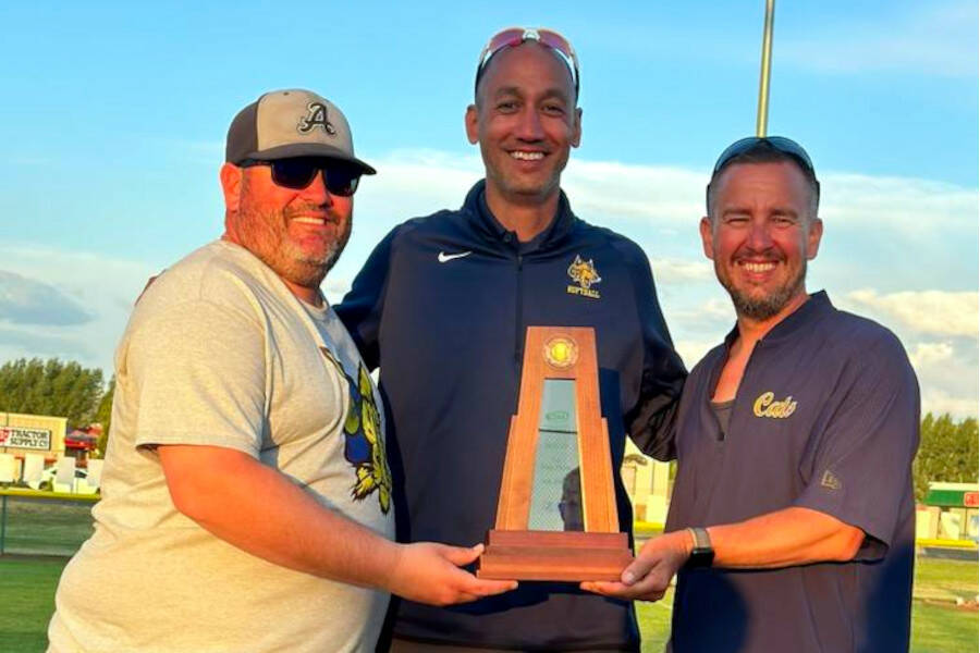 SUBMITTED PHOTO Aberdeen assistant coach Brandon Siano, head coach Jimmy McDaniel, and assistant coach Kyle Scott pose for a photo with the 2A State fourth-place trophy on Saturday in Selah.