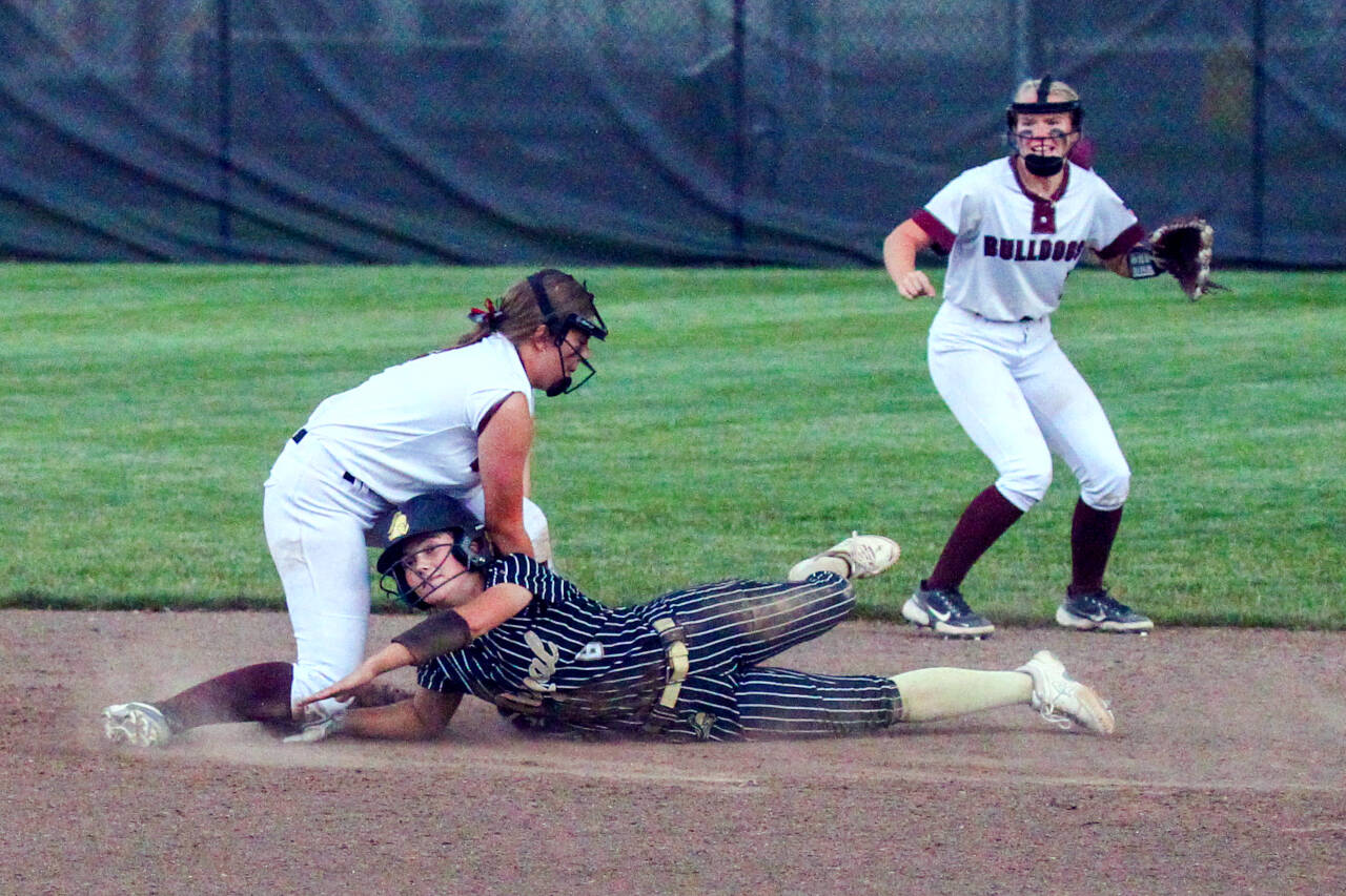 PHOTO BY SHAWN DONNELLY 
Montesano senior second baseman Jordan Karr, left, puts the tag on Royal’s Lily DelaRosa during the Bulldogs’ 8-2 win over Royal in the 1A State Softball Championship game on Sunday in Richland.