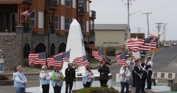 A Coast Guard color guard and veterans organizations parade the colors during the remembrance of those who put out to sea and did not return on May 28 in Westport. (Michael S. Lockett / The Daily World)