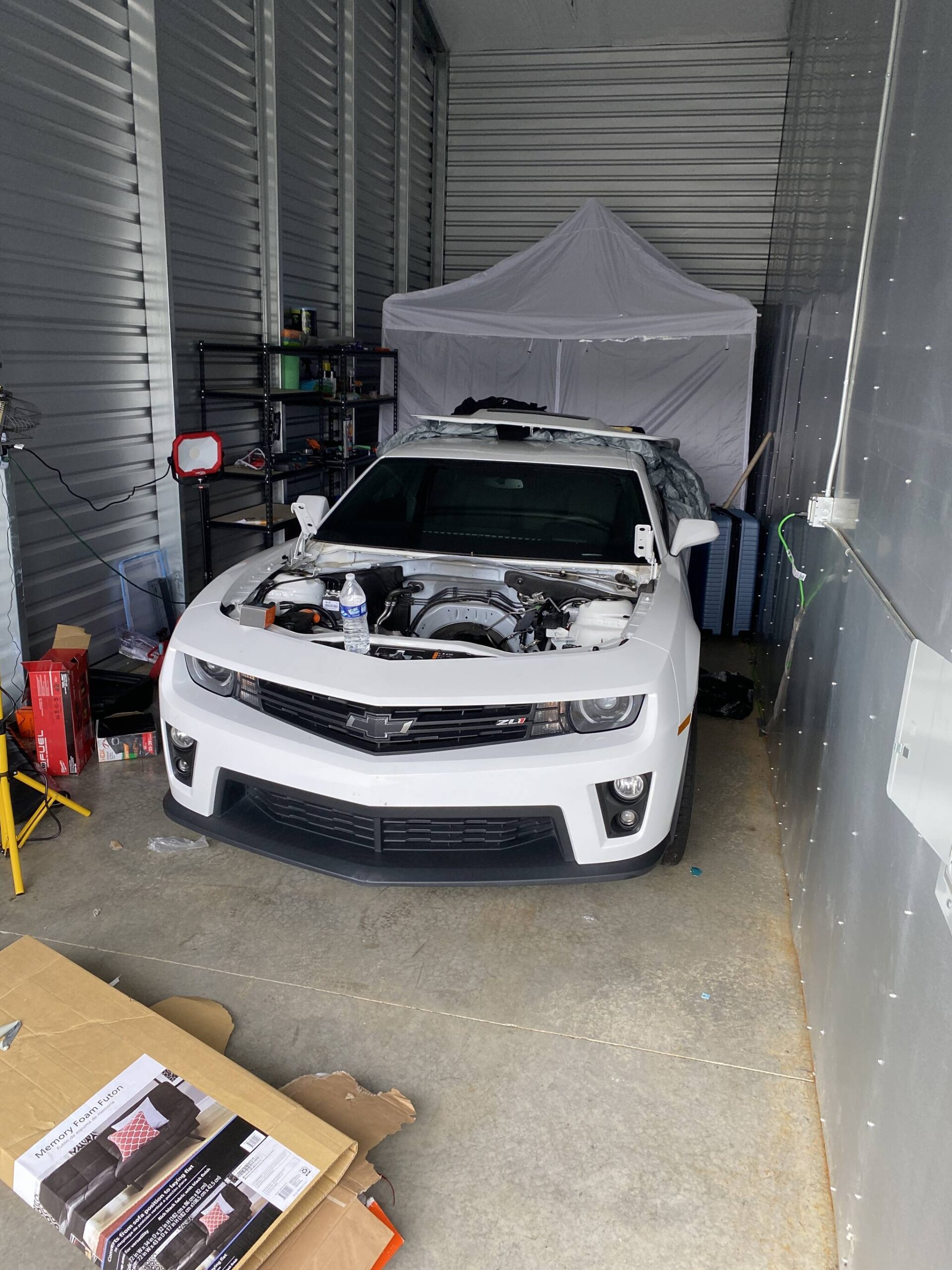 A sports car stripped of its components was one of the discoveries in a storage space registered to a man convicted last month of identity theft following his arrest in Aberdeen. (Courtesy photo / Aberdeen Police Department)