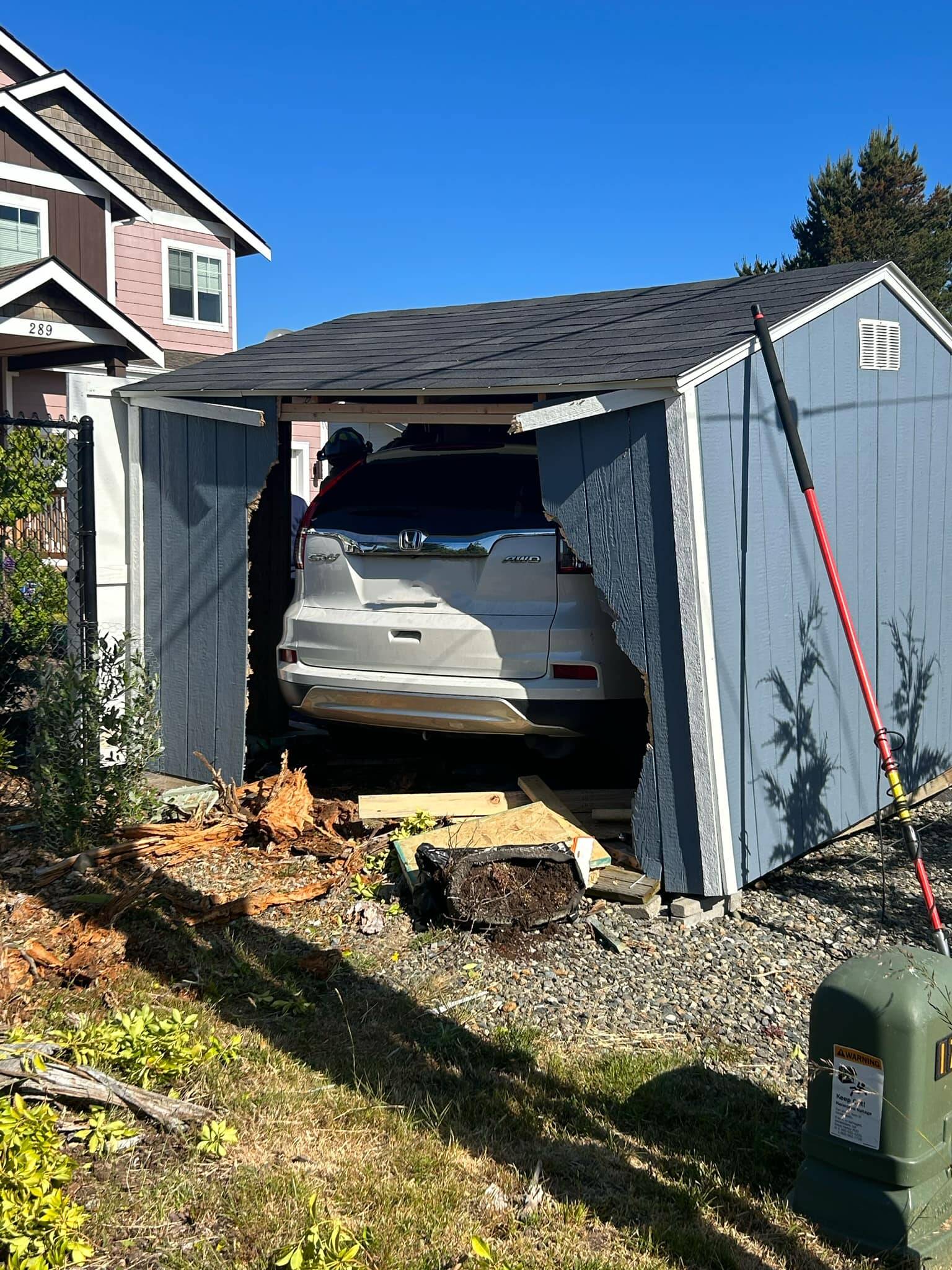 A visitor to Ocean Shores drove through a shed Monday morning after losing consciousness. (Courtesy photo / Ocean Shores Fire Department)