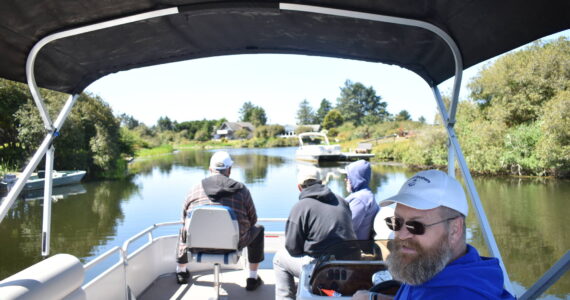 Photos by Clayton Franke / The Daily World
Jeff Owen, co-founder of Canal Brothers of Ocean Shores, which provides free canal tours to the public, captains his 16-foot pontoon on Friday, June 2, accompanied by friends Dale Vacknitz, Pete Nonan and Frank Elduen in the bow.
