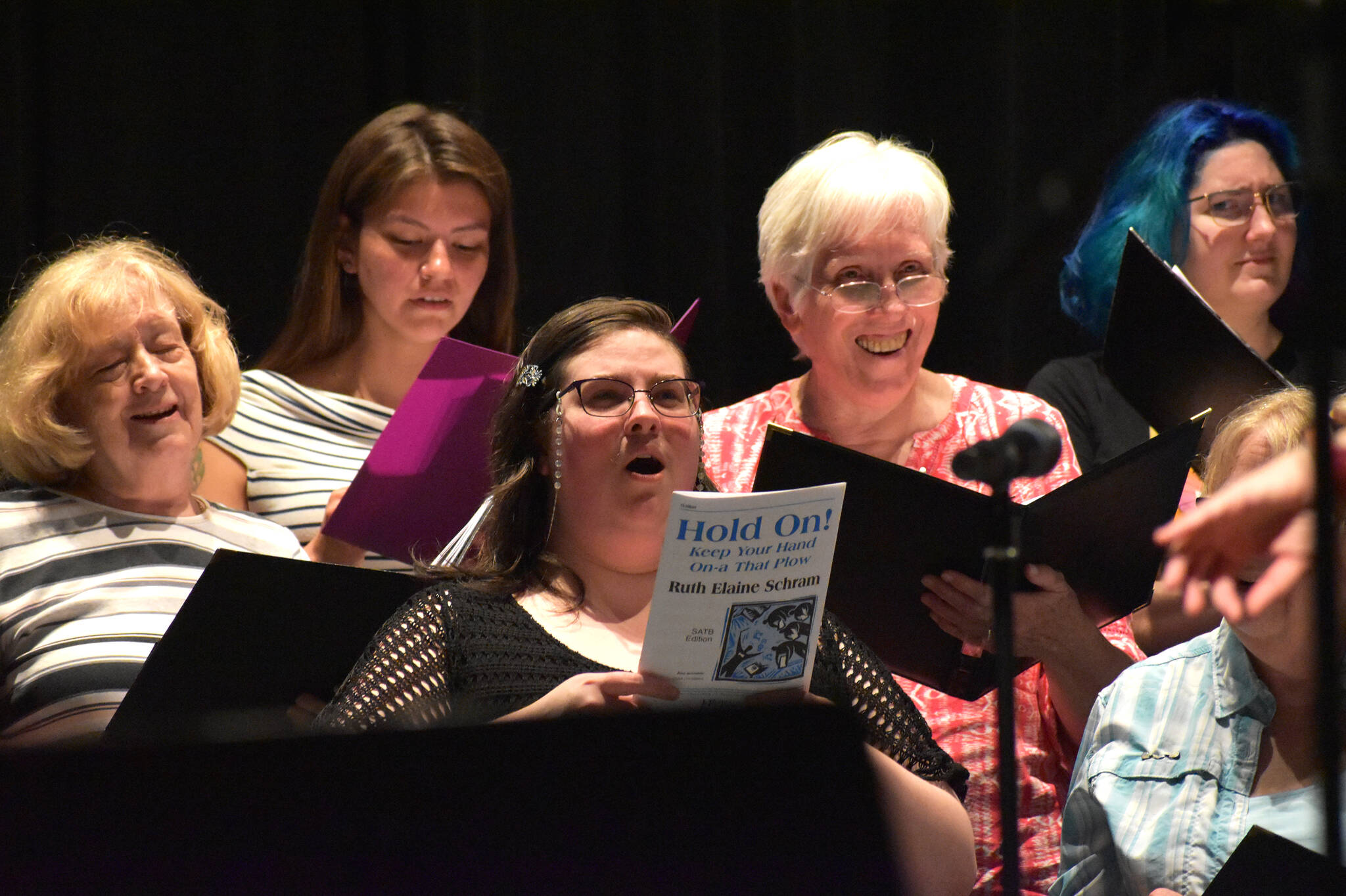 Matthew N. Wells / The Daily World
Sopranos from GHC’s Civic Choir, from left — Cheryl Guth, Trisha Charlie, Laurel Sheffield, Marrilee Rhoads and Alexa Amarok — sing “Hold On,” during Tuesday night’s rehearsal at The Bishop Center for the Performing Arts. It was the last rehearsal before Sunday’s performance, which begins at 2 p.m. It’ll be followed by the college’s concert band.