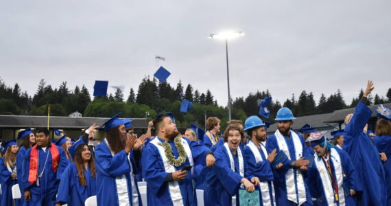 Clayton Franke / The Daily World
Graduates of Grays Harbor College toss their hats in the air after the completion of the GHC commencement ceremony on Friday, June 23 at Stewart Field in Aberdeen.