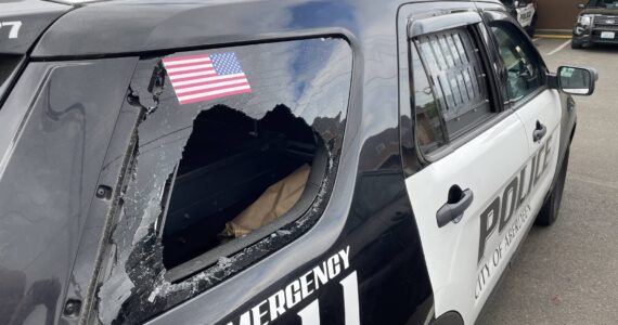 An Aberdeen man headbutted through this police car window as he was being taken to the hospital to evaluate his stupendous blood alcohol content following his arrest for assault on Saturday, July 8. (Michael S. Lockett / The Daily World)