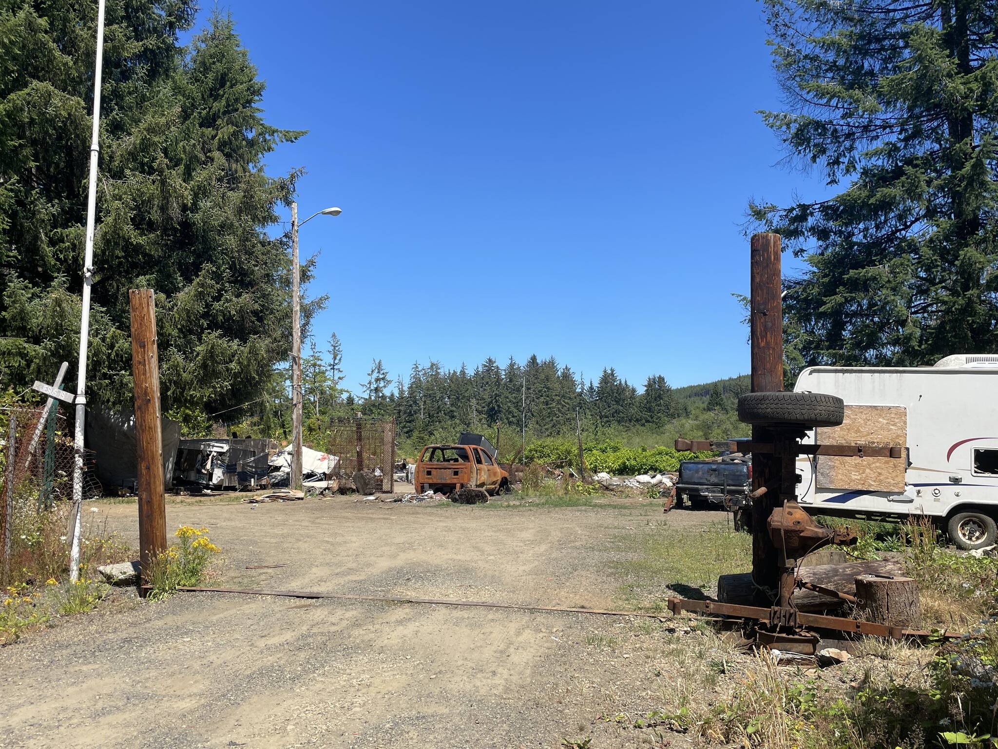 A derelict property was the site a of a trailer fire earlier in the week that completely destroyed a truck camper. (Michael S. Lockett / The Daily World)