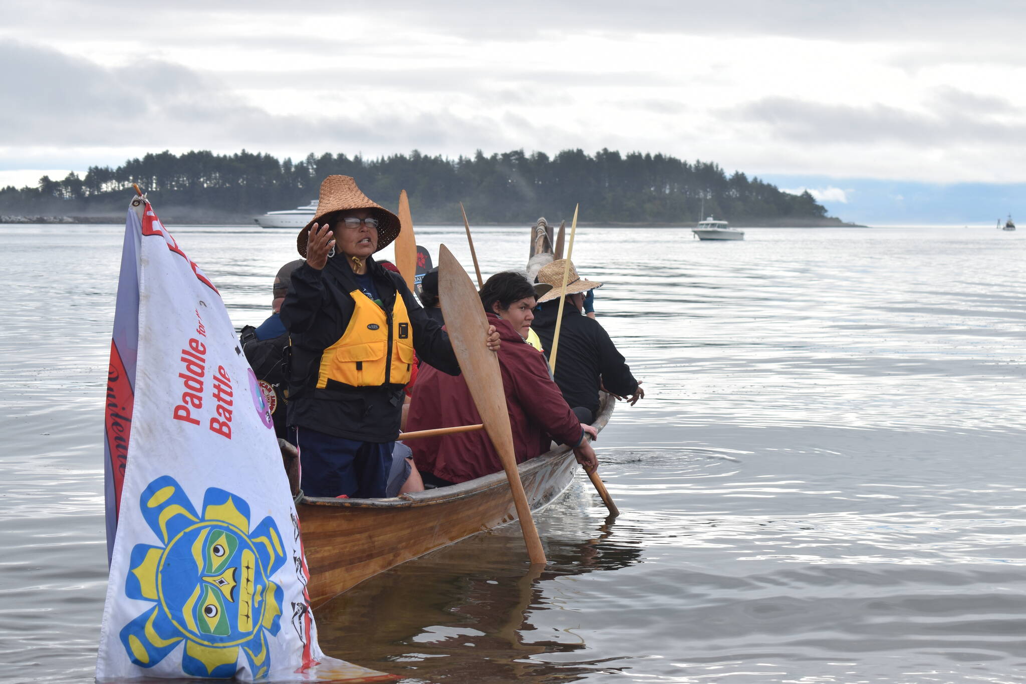 Ann Penn-Charles, a Quileute cultural leader and canoe skipper, asks for permission from the Makah tribe to leave Neah Bay Saturday morning, July 22. (Clayton Franke / The Daily World)