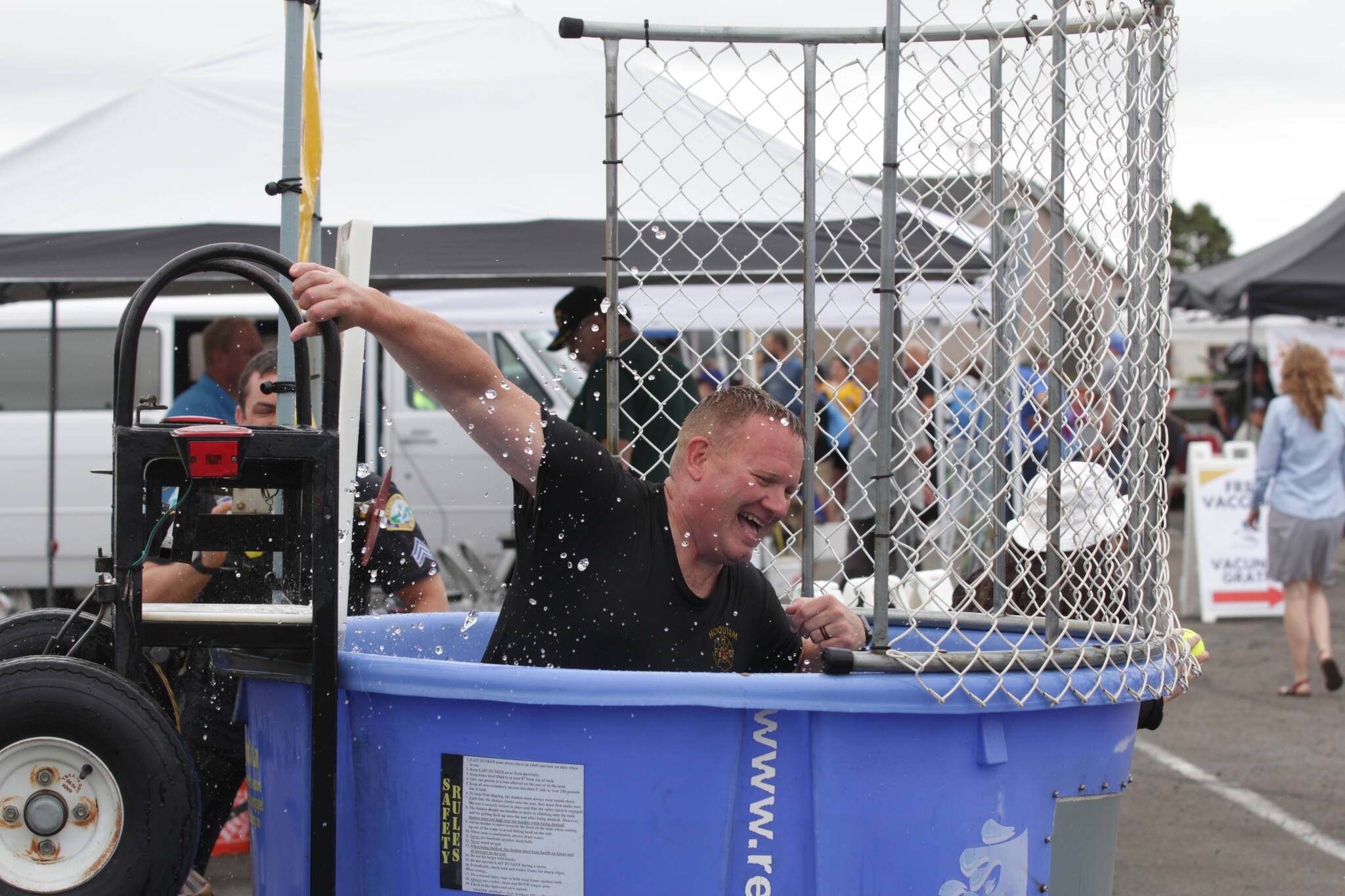 Hoquiam Fire Chief Matt Miller gets dunked during the county’s Emergency Preparedness Expo on July 22. (Michael S. Lockett / The Daily World)