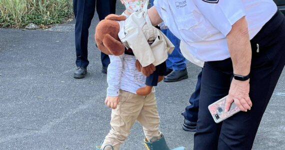 The Daily World File
Betsy Seidel, Hoquiam Police Crime Watch coordinator, has McGruff the Crime Dog Jr., give a kiss to one of the many children at National Night Out on Tuesday, Aug. 2, 2022, at Polson Museum.