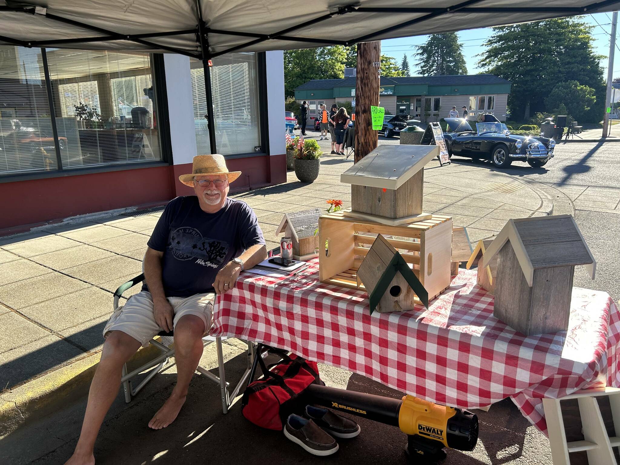 Tom Lane sells his homemade bird houses at The HIstoric Montesano car show on July 15. (Lillian Saeger / The Daily World)