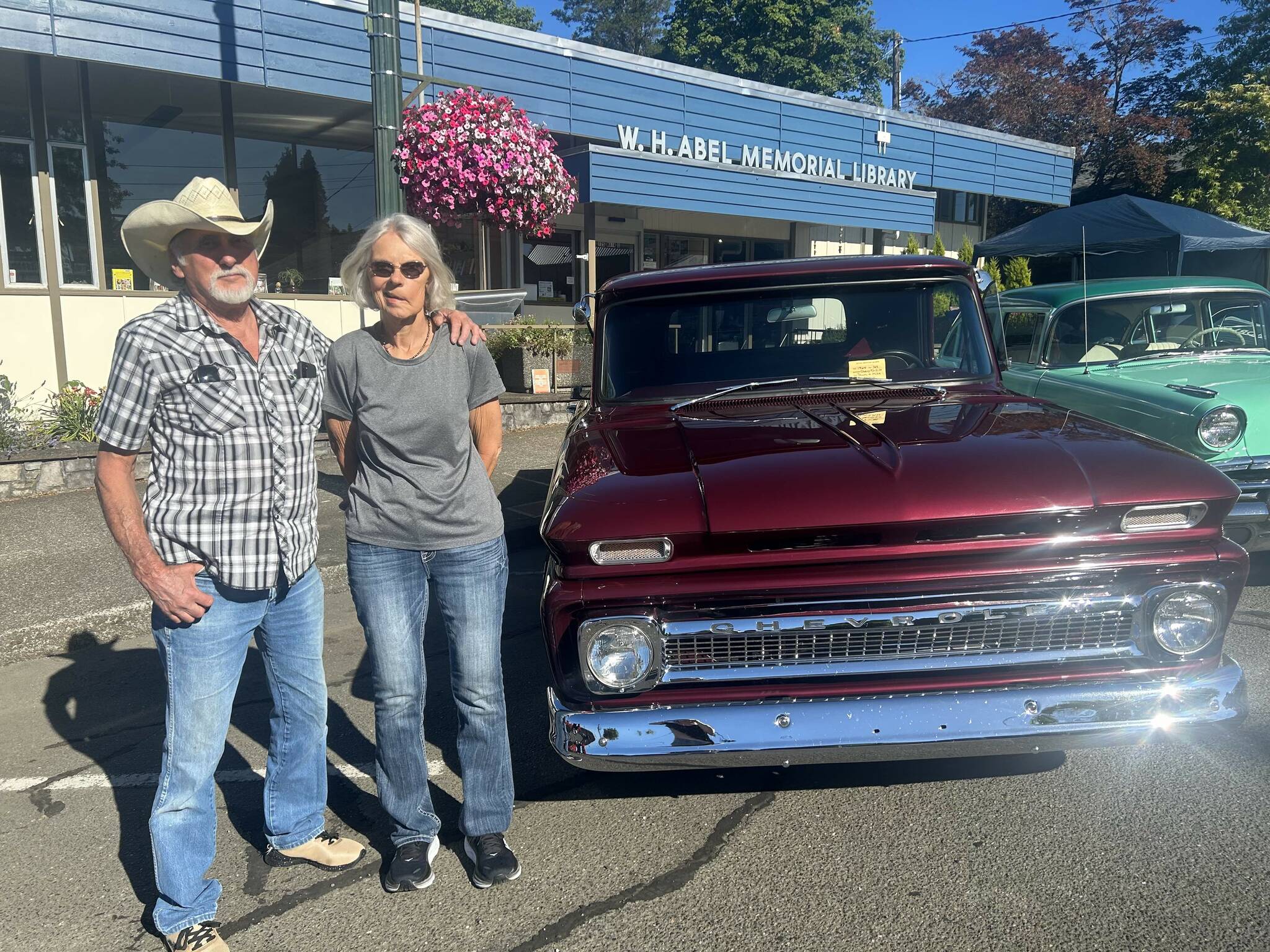 Donna Murphy and Mike Neal pose with their 1964 Chevy truck during the Historic Montesano Car Show on July 15. (Lillian Saeger / The Daily World)