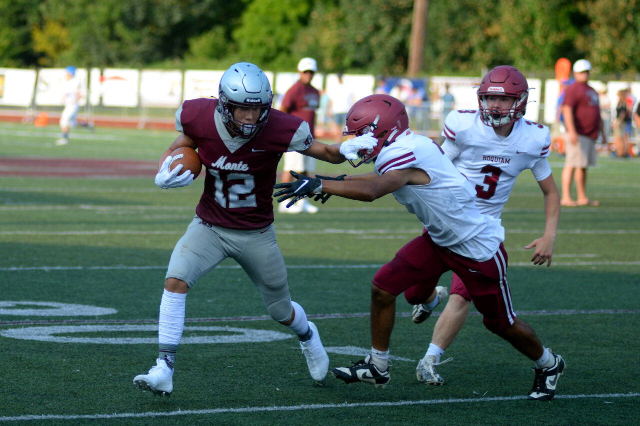 RYAN SPARKS | THE DAILY WORLD Montesano’s Torren Crites (12) tries to run away from Hoquiam’s Aden Bennett-Bryson during the 15th Annual Montesano Jamboree on Friday at Jack Rottle Field.