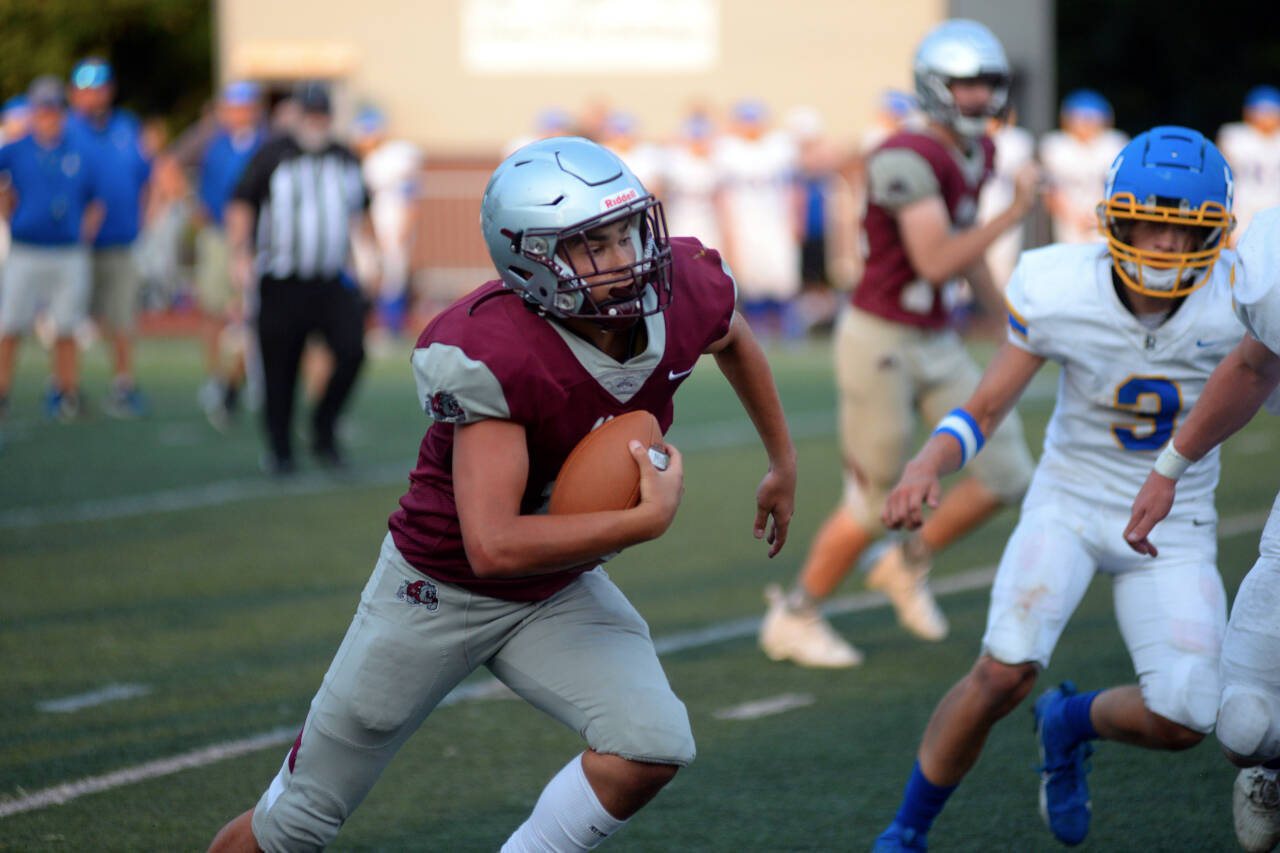 RYAN SPARKS | THE DAILY WORLD Montesano quarterback Jaxson Wilson carries the football against Rochester during the 15th Annual Montesano Jamboree on Friday at Jack Rottle Field.