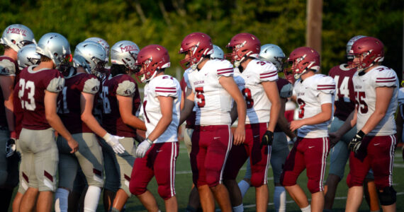 RYAN SPARKS | THE DAILY WORLD Players from Hoquiam (foreground) and Montesano football teams shake hands during the 15th Annual Montesano Jamboree on Friday at Jack Rottle Field.