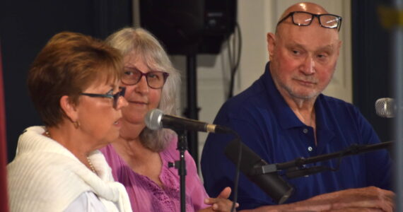Peggy Jo Faria, left, and Richard Wills, right, candidates for Ocean Shores City Council Position 6, spoke at a forum on Wednesday, Aug. 30 at the Ocean Shores Lions Club. The forum was moderated by Gina Rawlings, center, an organizer with community group Voice of the Shores. (Clayton Franke / The Daily World)