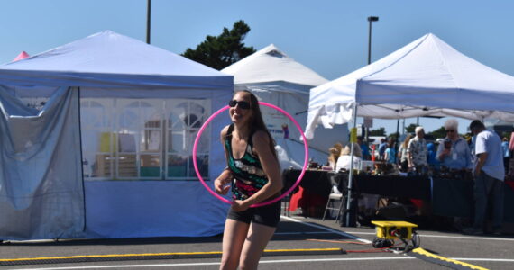 Matthew N. Wells / The Daily World
Mindy Morgan, of Ocean Shores, hulas with her hoop outside the Ocean Shores Convention Center. Morgan, who was demonstrating her skills during the 54th annual Associated Arts Ocean Shores Arts & Crafts Festival, had plenty of hoops for people interested in joining her. Morgan danced with hoop and had a lot of fun doing so. “I always love this festival,” she said.