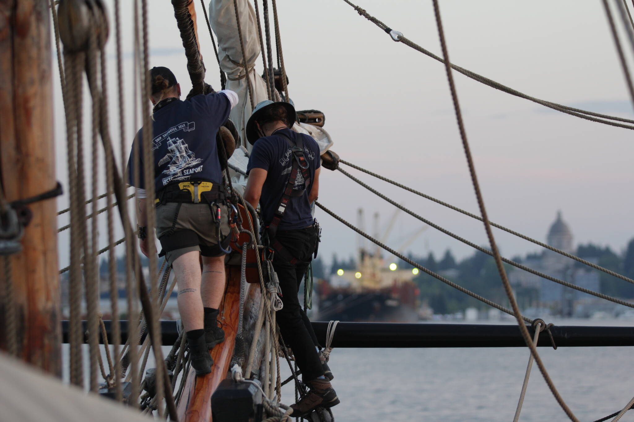 Sailors aboard the Lady Washington bring in sails as the ship heads in to port in Olympia on September 2. (Michael S. Lockett / The Daily World)