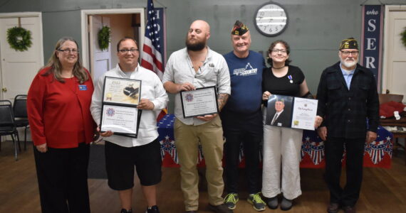 Clayton Franke / The Daily World
From left: Auxilary President Barbra Dyer, reporters Matthew N. Wells and Michael Lockett, veterans service officer Jim Daly, student Macie Leach and Aberdeen VFW commander Anthony Magri pose for a photo during the VFW Publication Contest award ceremony on Tuesday, Sept. 5.