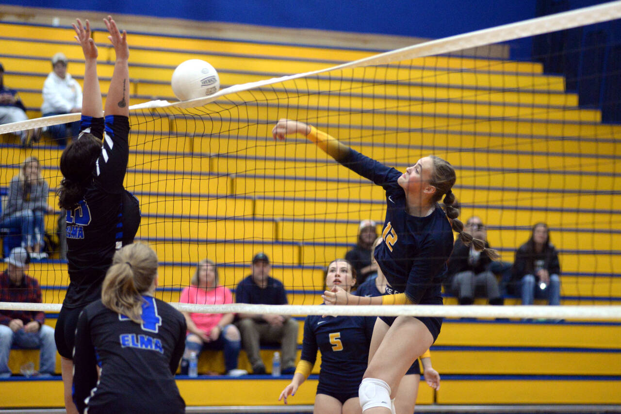RYAN SPARKS / THE DAILY WORLD Aberdeen middle blocker Lilly Camp, right, records a kill during a straight-set victory over Elma on Wednesday at Aberdeen High School.