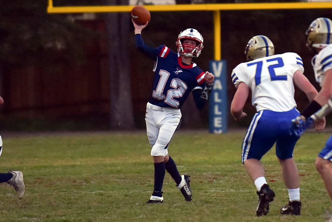 KODY CHRISTEN | THE CHRONICLE PWV quarterback Nate Fluke (12) sends a pass downfield in a 22-20 win over Adna on Friday in Menlo.