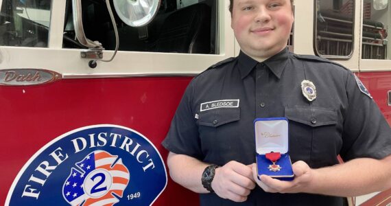 Michael S. Lockett / The Daily World
Volunteer Firefighter Aaron Bledsoe was recognized by Grays Harbor Fire District 2 for actions taken in a fire near his home with the Life Saving Medal.