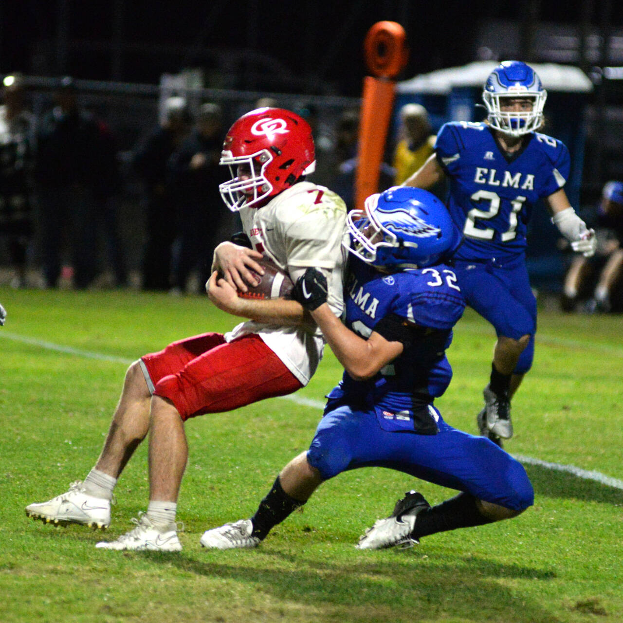 RYAN SPARKS | THE DAILY WORLD Elma linebacker Isaac Phillips tackles Castle Rock running back Ian Burton during the Eagles’ 28-10 loss on Friday at Davis Field in Elma.