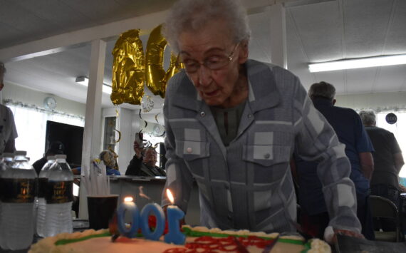 Clayton Franke / The Daily World
Faye Stringer blows out the candles on her 100th birthday cake at a party on Friday, Sept. 15 at Leisure Manor mobile home park in South Aberdeen. Stringer turns 100 on Sept. 26.