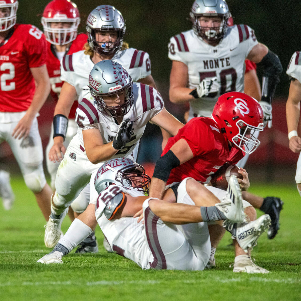 PHOTO BY FOREST WORGUM Montesano linebackers Peyton Damasiewicz (52) and Felix Romero (15) clamp down on Castle Rock running back Ian Burton during the Bulldogs’ 35-7 win on Thursday at Castle Rock High School.