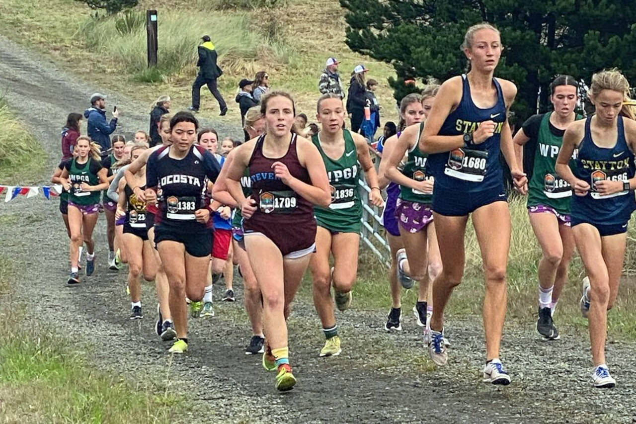 SUBMITTED PHOTO Ocosta junior Rebekah Stone (1383) competes in the 5K Difficult Course Female race at the Three Course Challenge on Saturday at Camp Rilea in Warrenton, Oregon.