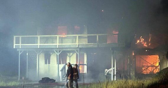 A fire ripped through an Ocean Shores home on Sunday, fueled by high winds, destroying it. (Courtesy photo / OSFD)