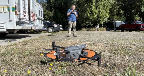 Michael S. Lockett / The Daily World
A member of King County’s 4x4 Search and Rescue team prepares to launch a drone during an evidence search in the Oakley Carlson case.