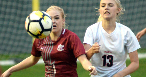 RYAN SPARKS | THE DAILY WORLD Hoquiam’s Chloe Dietrick (1) and Ocosta’s Scarlett Nelson make a play on the ball during the Wildcats’ 1-0 win on Thursday at Olympic Stadium in Hoquiam.
