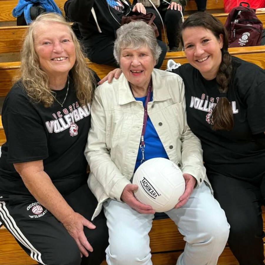 SUBMITTED PHOTO Ocosta honored legendary former head coach Betty Harrow, middle, at a ceremony ahead of the Forks-Ocosta game on Thursday in Westport. Harrow is flanked by former head coach Barbara Rasmus, left, and current head coach Erin Snider, representing the entirety of head volleyball coaches in the school’s history.