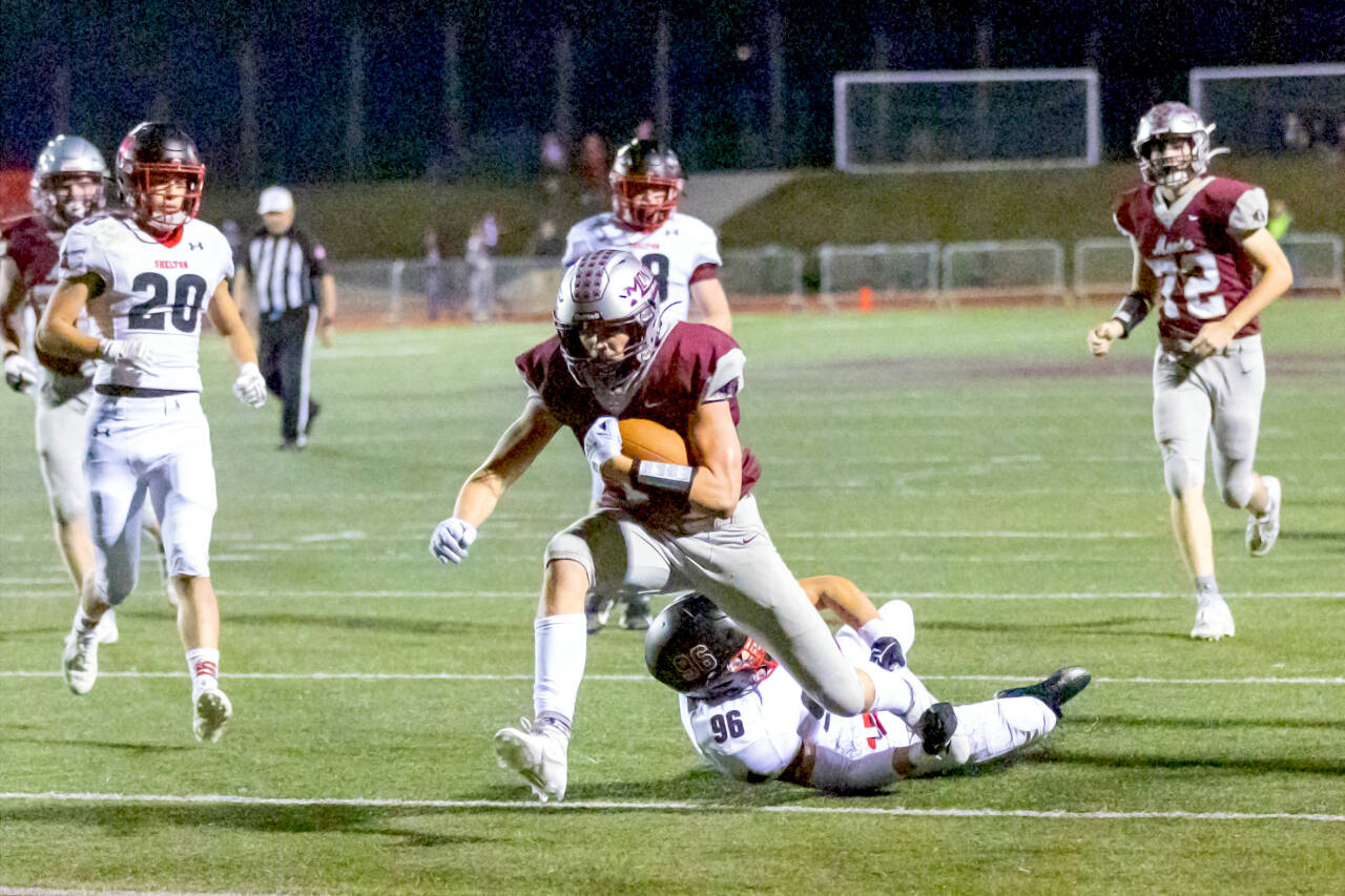 PHOTO BY SHAWN DONNELLY Montesano running back Gabe Bodwell runs through Shelton defenders for a touchdown in a 55-0 win on Friday at Montesano High School.
