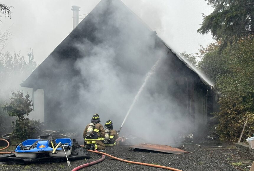 <p>Courtesy photo / OSFD</p>
                                <p>Ocean Shores firefighters attack a house fire on Monday afternoon.</p>