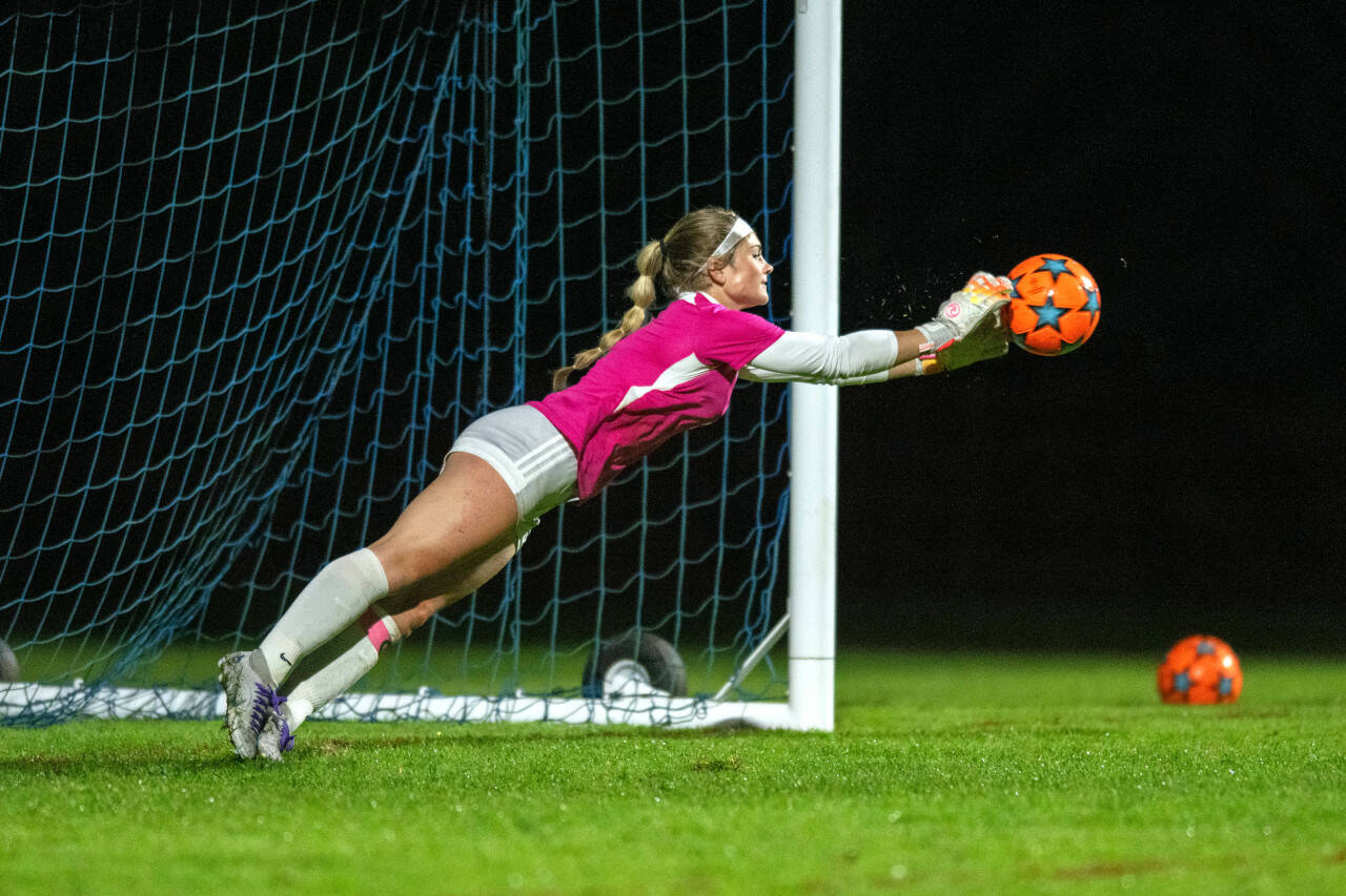 PHOTO BY FOREST WORGUM Montesano goal keeper Riley Timmons makes a diving save in a penalty-kick shootout against Elma on Tuesday at Davis Field in Elma.