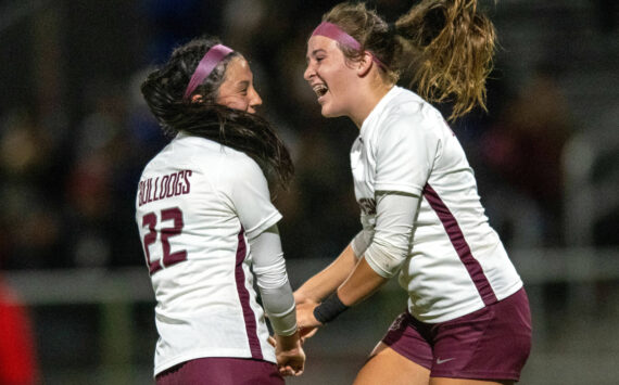 PHOTO BY FOREST WORGUM Montesano’s Sam Roundtree, right, celebrates with teammate Bethanie Henderson after Henderson scored the tying goal late in the second half against Elma on Tuesday at Davis Field in Elma.