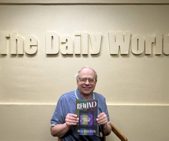 <p>Matthew N. Wells / The Daily World</p>
                                <p>Rick Anderson, former sports editor for The Daily World, holds his first published book, “Rewind: A Half-century of Classics, Cult Hits and other Must-see Movies.” Anderson was effusive in his praise of former newspaper coworkers John Hughes, Doug Barker, Kat Bryant, Janet Simmelink and Jeff Burlingame for their assistance through his career and for helping him to get his book proofread and published.</p>