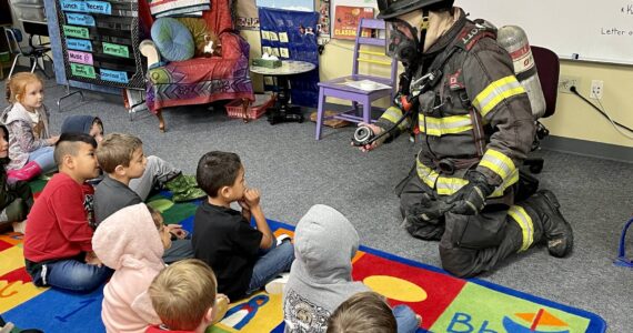 Michael S. Lockett / The Daily World
Aberdeen firefighter Kolby Lyle demonstrates his gear to kindergarten students at Robert Gray Elementary on Oct. 10 as part of Fire Prevention Week.