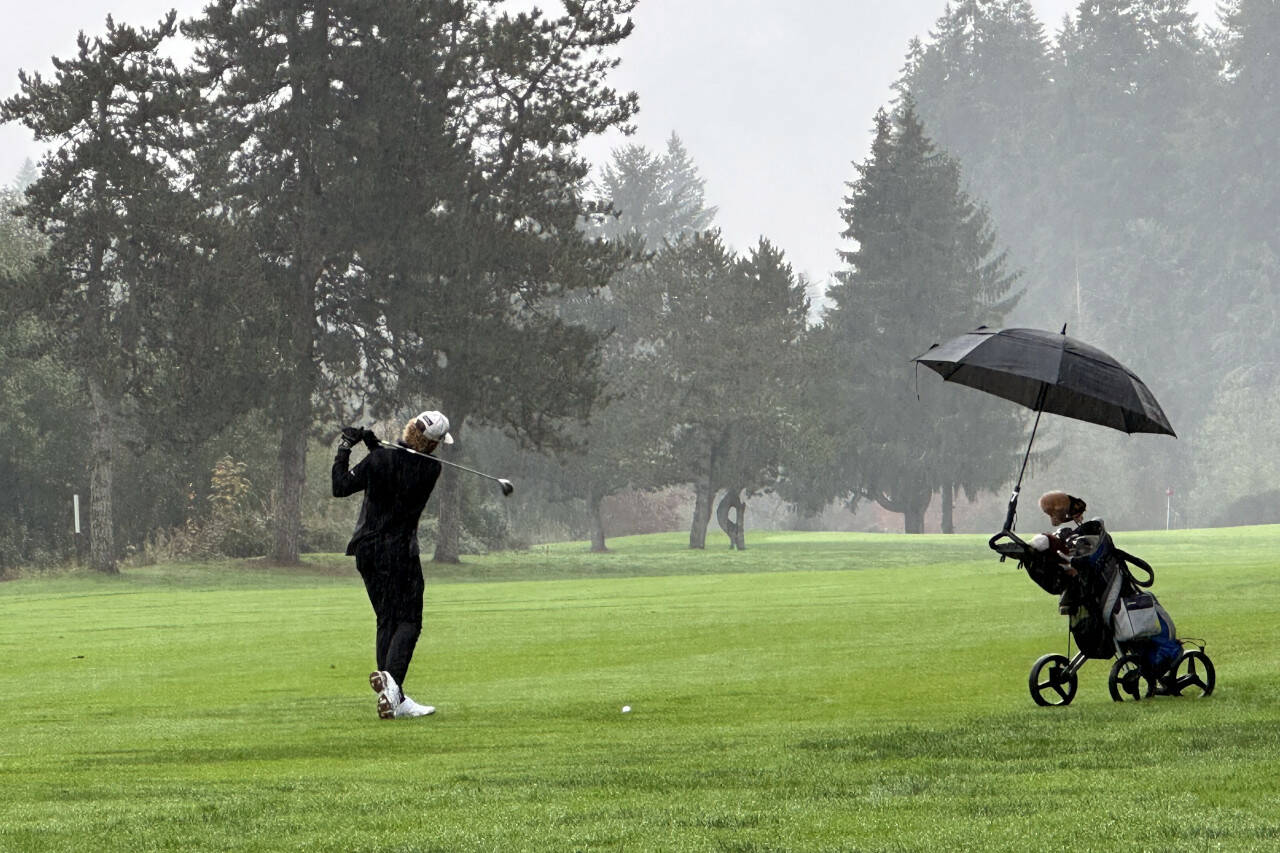 SUBMITTED PHOTO Elma’s Grant Vessey takes a shot during the first round 1A Evergreen District Championships on Monday at the Tumwater Valley Golf Course.