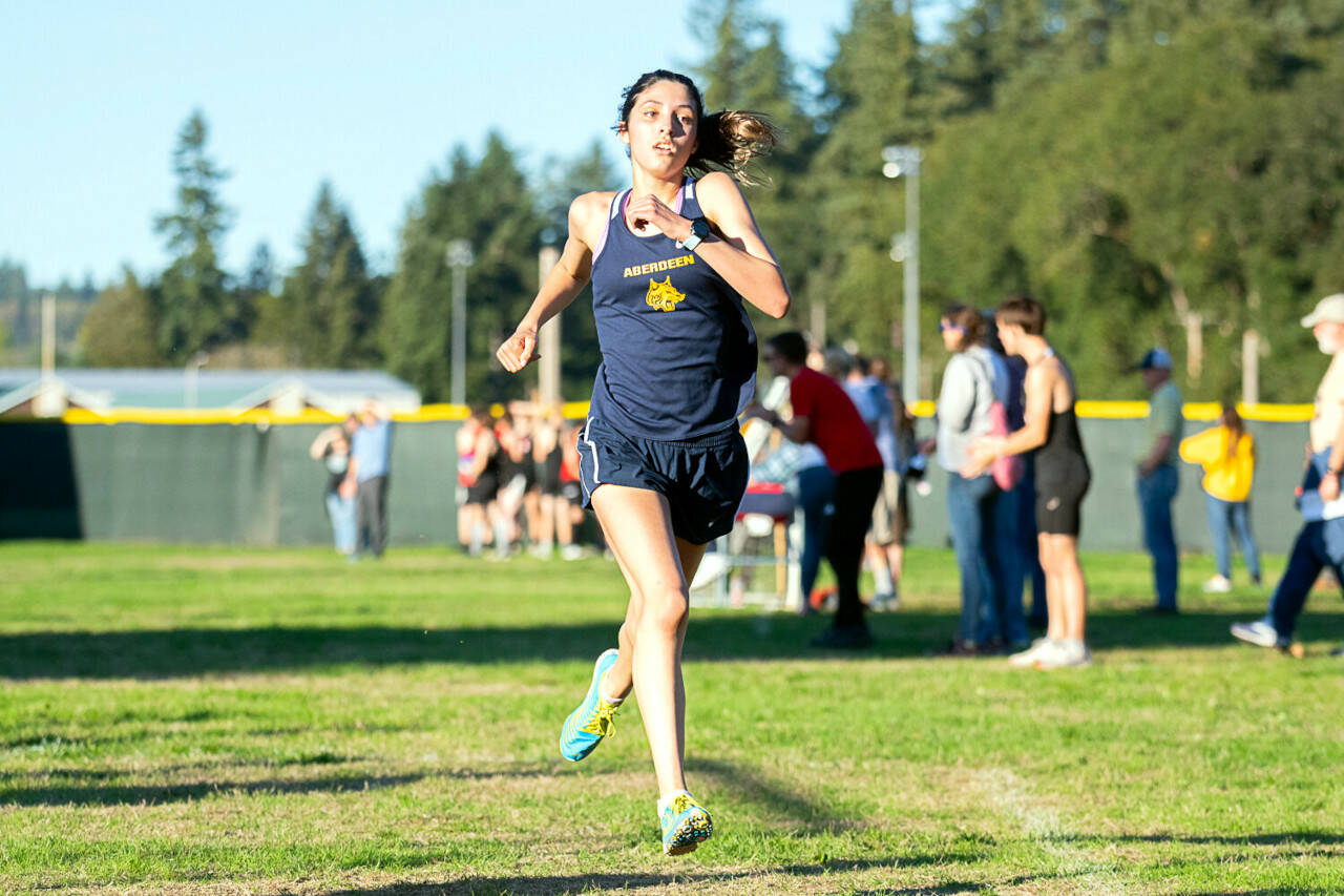 JOSH KIRSHENBAUM | THE CHRONICLE Aberdeen’s Mia Hallak crossed the finish line to win the girls’ race at the 2A EvCo Championships on Wednesday at Borst Park in Centralia.