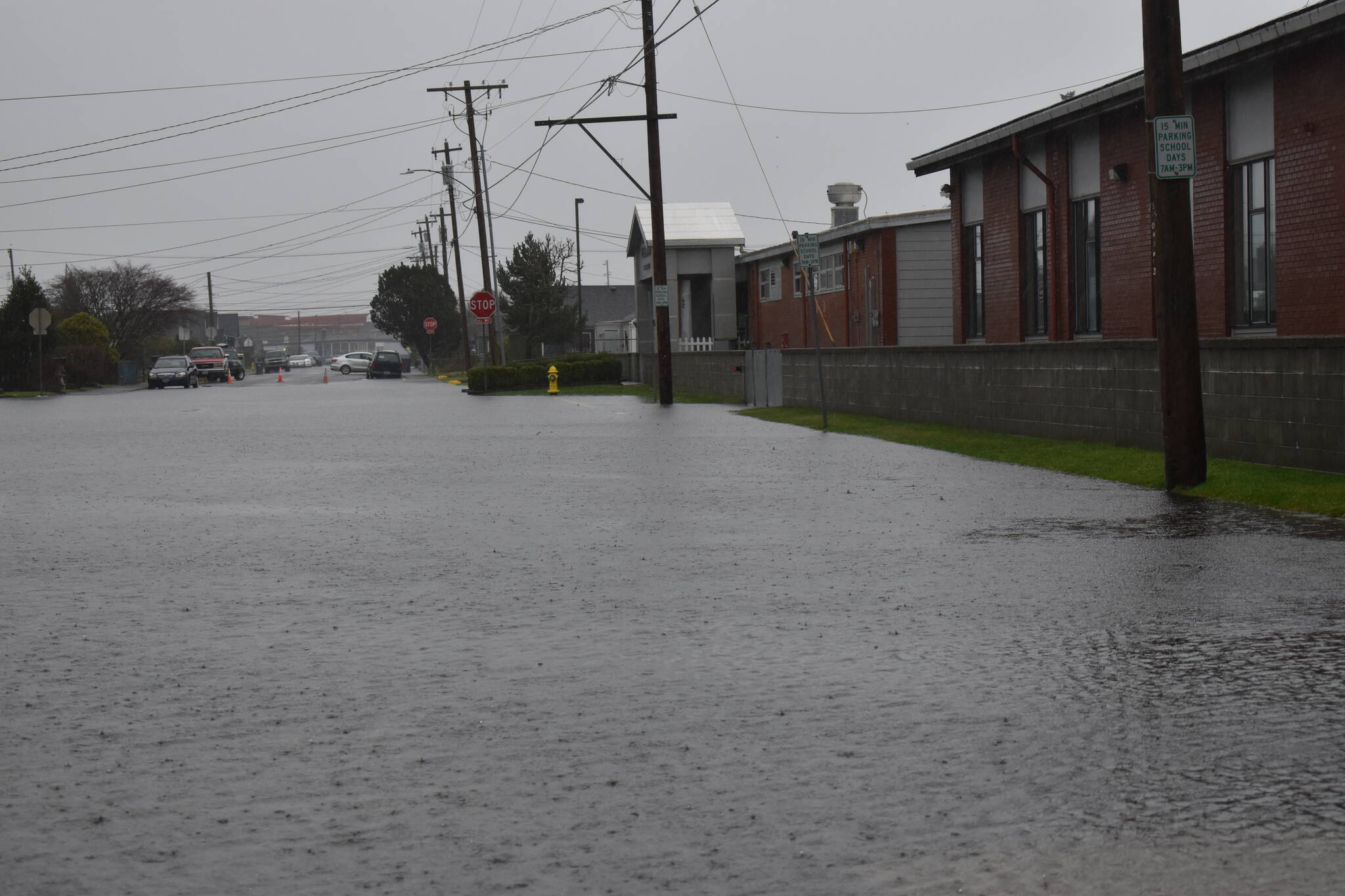 Rain on Thursday, Jan. 6, 2022, combined with a king tide measured at 10.4 feet, overwhelmed streets throughout Grays Harbor County, such as Bay Avenue’s stretch of road that runs in front of AJ West Elementary School in Aberdeen. (The Daily World file photo)