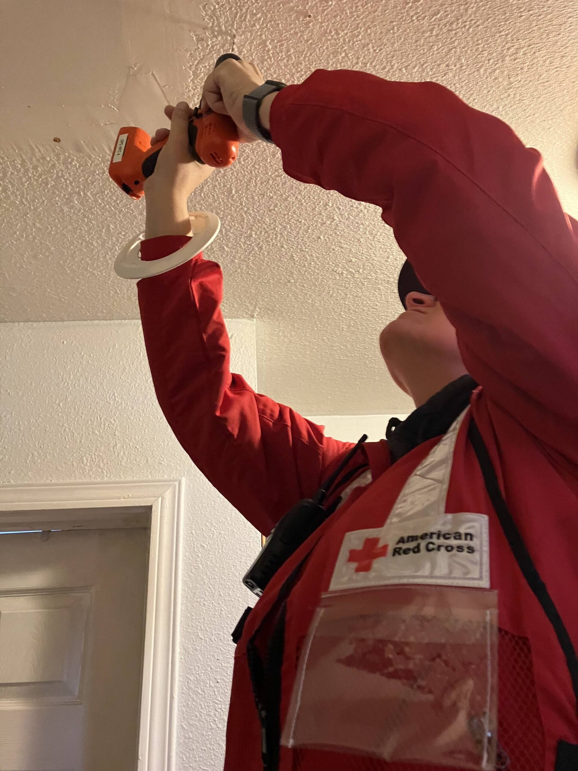 Betsy Robertson
A Red Cross member helps install a smoke detector in a county home on Oct. 21 as part of a push against the region’s high fire risk.