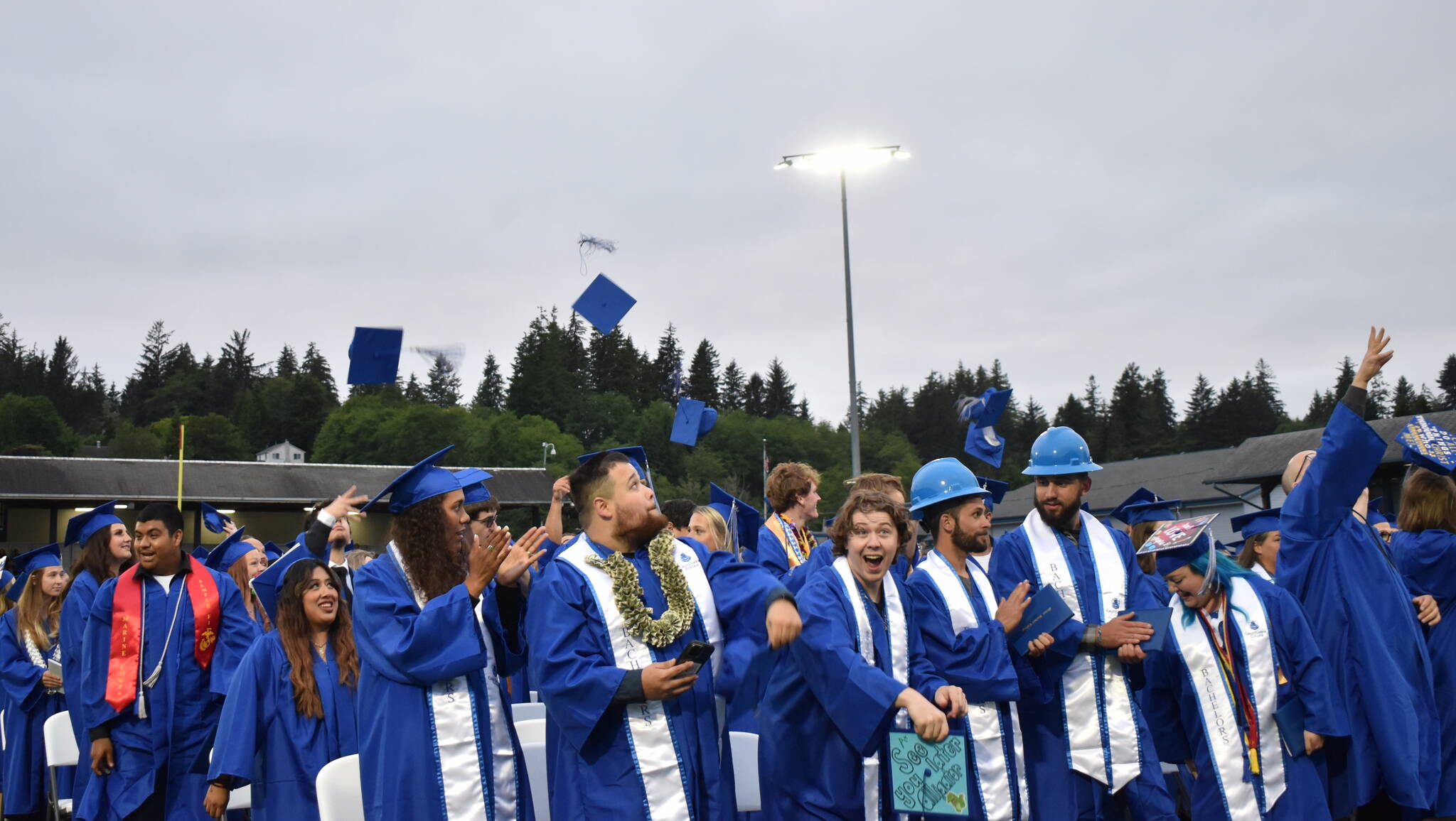 Clayton Franke / The Daily World
Graduates of Grays Harbor College toss their hats in the air after the completion of the GHC commencement ceremony on Friday, June 23 at Stewart Field in Aberdeen.