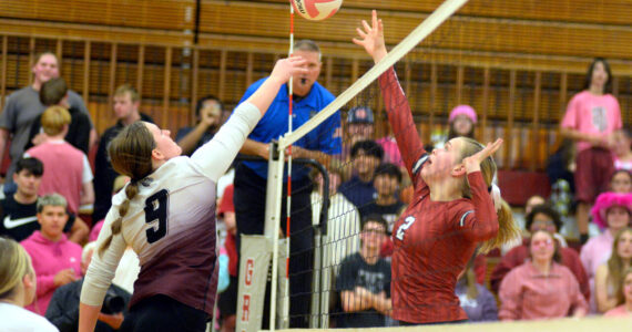 RYAN SPARKS | THE DAILY WORLD Montesano junior Kylee Wisdom (9) and Hoquiam senior Kristina Goulet (2) compete for a ball at the net during the Bulldogs’ 3-1 win on Thursday at Hoquiam Square Garden.