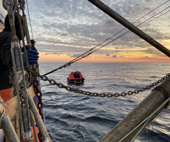 <p>(U.S. Coast Guard Pacific Northwest) A &ldquo;good Samaritan&rdquo; vessel on Thursday, Oct. 26 approaches a life raft holding one of the two crew members from the missing fishing vessel Evening, found alive nearly two weeks after the boat was scheduled to return to Grays Harbor. The other crew member remains missing.</p>